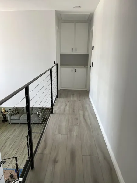 AJM Construction Services project in the Inland Empire: upstairs hallway with modern cable railing