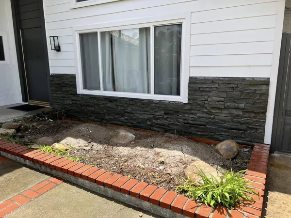 AJM Construction Services: brick and stacked-stone planter wall, hardscape project in Canyon Lake