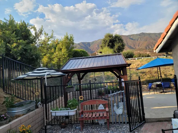 AJM Construction Services: backyard gazebo and iron fence project in the Inland Empire