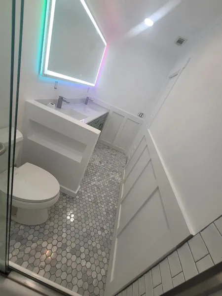 AJM Construction Services project in the Inland Empire: tile shower with mosaic floor in a bathroom remodel