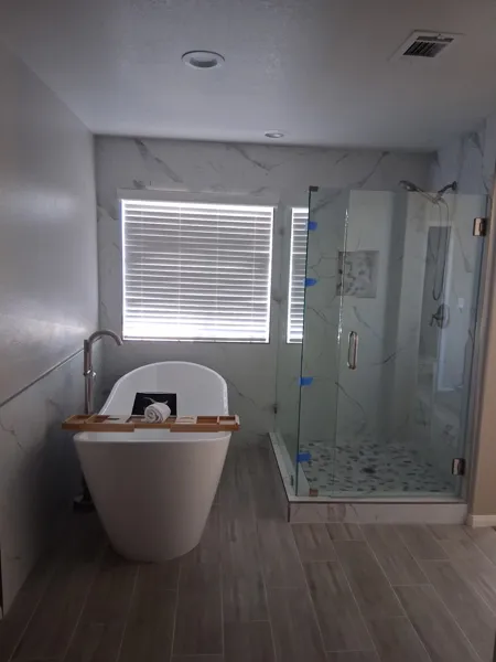 AJM Construction Services: master bathroom remodel with freestanding tub and frameless glass shower