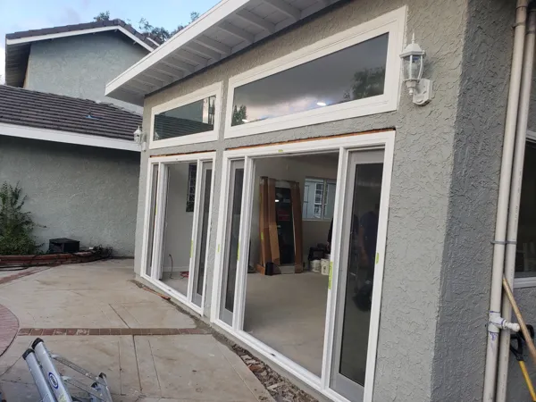 AJM Construction Services: room addition with sliding glass doors and transom windows